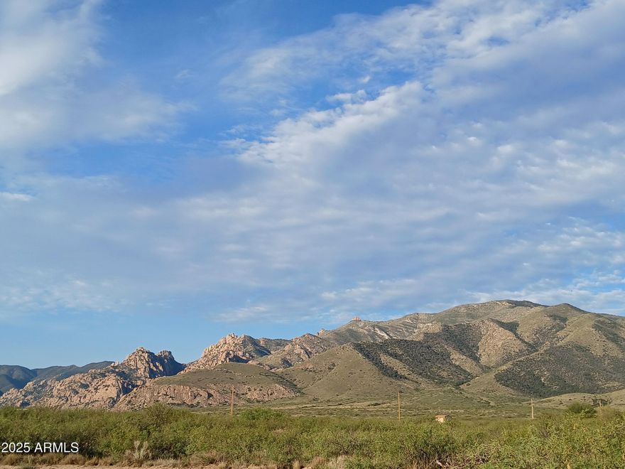 Great opportunity to own 10 easy to access acres that's staring right into the gateway of the Cochise Stronghold. Power and fiber-optic internet on the corner of the lot encourage quick and painless development. Gentle sloping puts this land well above the neighboring valley. Sip coffee and sit eye-level with the clouds over the Sulphur Spring. The land itself is a balance of dense mesquite forest and grassy clearings. Rich biodiversity, dynamic geology, and year-round wildlife activity promise nuance and novelty with every visit. Desirable RU-4 zoning allows for many expansion options. Do things your way. Direct access from Dreamcatcher. The National Forest is 10 minutes away. World-class climbing, birding, and hiking. Only an hour south of Tucson. Seller is a licensed real-estate broker