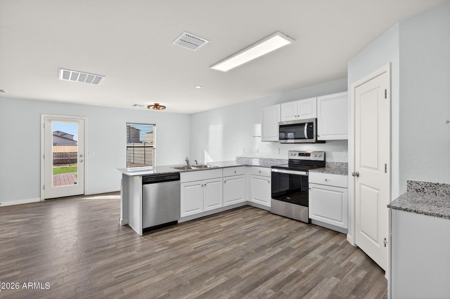 Welcome to easy living in the heart of Coolidge. This bright and thoughtfully designed home offers an open layout that seamlessly connects the living, dining, and kitchen spaces, creating a natural flow for everyday life and weekend gatherings. The kitchen features granite countertops, stainless appliances, and generous cabinetry for effortless functionality. The spacious primary suite provides a quiet retreat, while secondary bedrooms offer flexibility for guests, a home office, or hobbies. Step outside to a low-maintenance backyard with artificial turf and gravel landscaping, perfect for relaxing under Arizona skies. Conveniently located near schools, parks, and commuter routes.