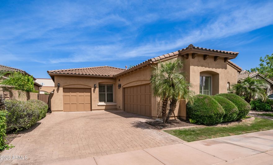 Beautiful South Tempe home in the desirable gated community Toscana.  An inviting private courtyard patio with fountain and electric shades welcomes you into this home with a beautiful iron door.  Enjoy entertaining family and friends in the gourmet kitchen with custom cabinetry, large island, gas cooktop with chef's stainless hood, GE Monogram double convection oven, microwave and stainless Sub-Zero refrigerator, granite counters, tiled granite backsplash, and a wine chiller. The large family room and generous dining area offers 14' ceilings w/surround and a gas fireplace.  Wood shutters, 20'' Italian tile, 8' doors and custom lighting throughout!  Split master bedroom with 12' ceilings large soaking tub, tiled walk-in shower, dual sinks and Walkin closet. Spacious secondary bedrooms and bathrooms! The large den/office features a separate entrance that leads out to the front courtyard. The backyard features an extended patio where you can enjoy the sun or grill with friends. New HVAC in 2024! Living in the Toscana community means you'll enjoy gated privacy, greenbelts, and peaceful walking paths. This neighborhood is close to amazing schools, shopping, dining, entertainment, ASU and has fast access to the 101, 10, 60, and 202 freeways, making it easy to get anywhere in the Valley including minutes from Sky Harbor Airport for a weekend getaway!  From the tranquil courtyard fountain to the fireplace inside, this home is made for comfort, style, and easy living in a prime South Tempe location.