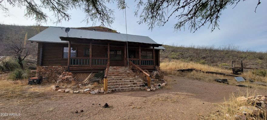 This is the perfect self sufficient getaway in these crazy times! Picture yourself on a mountain side log cabin with the deer and other critters for your neighbors. This home has some owned solar panels and a largely DC electric system for power. There is also an inverter and battery backup. There is a generator that pumps up the water from the well to a large water tank on the hils that gravity feeds the house. The property is partially fenced. The home has a beautiful wood cook stove as well as a gas range. There are gas wall heaters too. The bedrooms do not have closets currently. The sale includes parcels 103-37-013C&D. You will love all the deer, birds, and other wildlife each day! This property will not last. 2/3 well share.