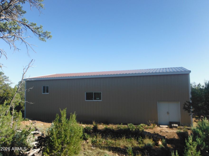 Property Description: Great Corner 5-acre Lot in Mogollon Ranch with 2400 sq.ft. Metal Building.Driveway access from Mogollon Trail Rd. The only paved road in the development. Lot is backed-up to US Forest Service trails and Wildlife Corridor. Metal Building is 60x40, insulated, storm windows, metal doors. Metal Building Permit finalized. 2nd building is ready to be built. Preliminary plans for a single-family residence have been submitted to the Association but have not been cleared yet. Power, water, utilities available to hook-up. Needs Septic installed. HOA Dues. Survey completed. The property is on the HOA wait list for a Water Meter. Driveway is dirt and Lot has been cleared for access. Many options and variables with this Lot. Most of the layout completed, but let your own decisions finish the possibilities, your way. Address: 8670 Haven Crest Dr. Happy Jack, AZ 86024 Parcel number: 40304144