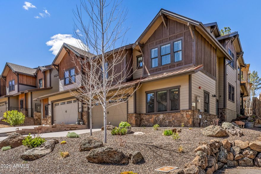 Luxury mountain-modern townhome with gorgeous mountain views in the prestigious Flagstaff Ranch private community, which includes a top-rated Troon-managed golf course. This 3 bedroom, 3 bath home also features a large bonus room/den and loft area, offering flexible living space. Highlights include vaulted ceilings, wood flooring, high-end appliances, wine fridge, and built-in surround sound. Offered as a turnkey home with Restoration Hardware and Crate & Barrel furnishings, all TVs, outdoor furniture, Traeger smoker and snowblower included. The exterior has been updated with new hardscape, lush mountain landscaping, French drains and yard lighting. Also, custom built-in garage cabinets provide ample storage. Exceptional move-in-ready luxury opportunity! Golf Membership offered separately.