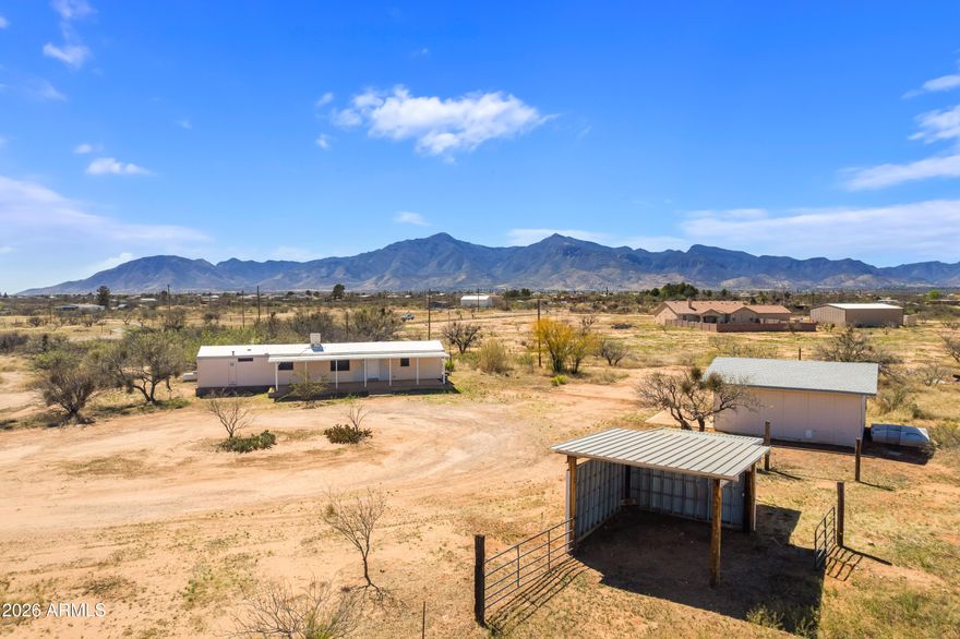Enjoy peaceful living in this refreshed 2-bed/2-bath home set on 4+ acres. Inside, you'll find an updated interior featuring new flooring, paint, cabinetry, and countertops, creating a bright, clean, move-in-ready feel that contrasts with the home's original exterior character. The home is set on block skirting with dual-pane windows for added efficiency. Outside, enjoy the open surroundings, perfect for quiet mornings and relaxing evenings. The 24x24 single-car garage features its own electrical panel and a man door, offering space for storage, projects, or hobbies. For those seeking a rural lifestyle, the property includes equestrian potential with a 60x40 corral (ready for your finishing touches) and a 2-horse stall, a versatile property offering space, functionality, and rural charm.