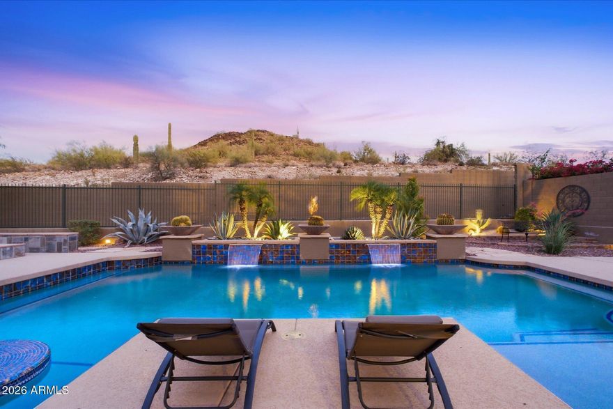 Welcome to 38521 N Donovan Court, a beautifully enhanced home in Anthem Parkside, a desirable and well-rounded master-planned community in Arizona. From the moment you arrive, the home makes a memorable impression. Positioned hilltop to capture breathtaking mountain views, desert views, and city light views from both inside and out, this home offers the Arizona lifestyle buyers are searching for -- open spaces, natural beauty, thoughtful upgrades, and access to outstanding community amenities. The rare hilltop location offers a stunning setting with a sense of privacy and peace, accompanied by spectacular sunrise/sunset views that elevate everyday living. Another standout feature is the climate-controlled 4-car garage for exceptional space for vehicles, storage, hobbies or workspace needs. The home has thoughtful updates from the custom patio, added iron entry doors, iron gates, an iron RV gate, and added windows that capture the views and create a custom feel while within a Pulte community. Inside, the floor plan has been thoughtfully opened from the original design to better support modern living. The result is a more spacious, connected, and functional layout that feels welcoming, bright, and easy to enjoy. Additional windows were added to capture the surrounding views, filling the home with natural light and creating beautiful sightlines throughout the interior.

Custom touches can be found throughout the home, with especially noteworthy enhancements in the primary suite. Designed with comfort and style in mind, the primary retreat offers a refined feel and a peaceful connection to the surrounding desert landscape. The bathrooms have also been tastefully updated, including updated bathroom countertops and showers, giving the home a fresh, elevated look.

Located within the grand Anthem Community, residents enjoy access to the incredible amenities and conveniences that make Anthem such a sought-after master-planned community. From parks, trails, pools, activities, pickleball, volleyball, basketball, and recreation in addition to convenient shopping, dining, community events, freeway access, and easy everyday services, Anthem offers a lifestyle that blends comfort, convenience, and Arizona's natural beauty.

With mountain backing, sweeping views, custom upgrades, an opened floor plan, updated bathrooms, added windows, iron details, an RV gate, and a rare climate-controlled four-car garage, 38521 N Donovan Court is a standout opportunity in Anthem.