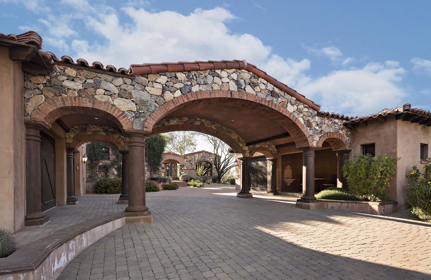 This spectacular, Old World-designed home is sited on 1.75 acres and has exceptional views of Pinnacle Peak, sunsets and city lights with a panoramic view down the 4th fairway and lake at The Estancia Club * Built by RJ Gurley Custom Homes with the finest finishes including Venetian plastering throughout, granite counters and top-of-the-line appliances * Enjoy outdoor living at its best on an oversized covered patio overlooking a lap pool and spa * An air conditioned 3-car garage and detach guest house complete the residence *