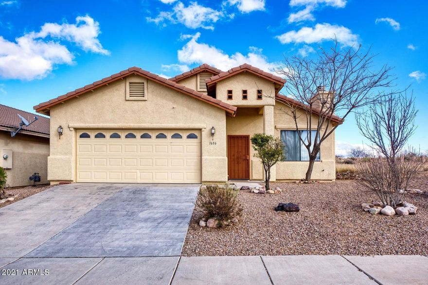 Mediterranean style home 1600 + Sq. Ft. Open Floor Plan,  3 Bedroom 2 Bath, Master complete with dual sinks, Jet tub, Large walk in closet. Home is loaded with up grades, Vaulted ceilings, Granite kitchen counters, Tall dark cabinets, High top breakfast bar, Dinning area with back yard views , Sunny bright living room with Gas Fireplace,  covered patio, additional concrete slab great place to put in a hot tub, Low maintenance front and back yard, No back yard neighbors as lot borders natural land. Panoramic Mountain views, Grape vines, trees, plants, brushes all on automatic irrigation, 2 car garage, and storage shed.
You wont want to miss this one!!!