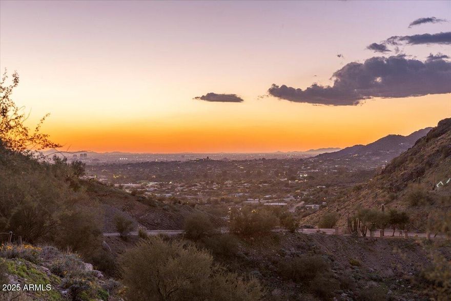 Perched at the very top of Mummy Mountain, this extraordinary 5.17-acre
homesite represents one of the last truly irreplaceable parcels in Paradise Valley.
Located at the private end of Invergordon Road, this east-facing property offers
unmatched privacy, breathtaking day-to-night views, and the rare opportunity to
create a world-class luxury estate in one of Arizona's most prestigious settings. The property features a flat and expandable building area ideal for a grand custom
residence, thoughtfully positioned to capture sweeping panoramic views of the
McDowell and Superstition Mountains, glowing city lights, and unforgettable
sunrises. Afternoon and evening shade provided by the mountain creates a
naturally balanced and comfortable setting year-round. With paved road access, no HOA restrictions, and electric, water, and natural gas
conveniently located at the property line, this homesite offers exceptionalflexibility and ease of development. Just minutes from Paradise Valley's finest luxury retail, five-star dining, and resorts, this location delivers seclusion without sacrifice. This is more than landit is a legacy opportunity. If you can dream it, you can build it.