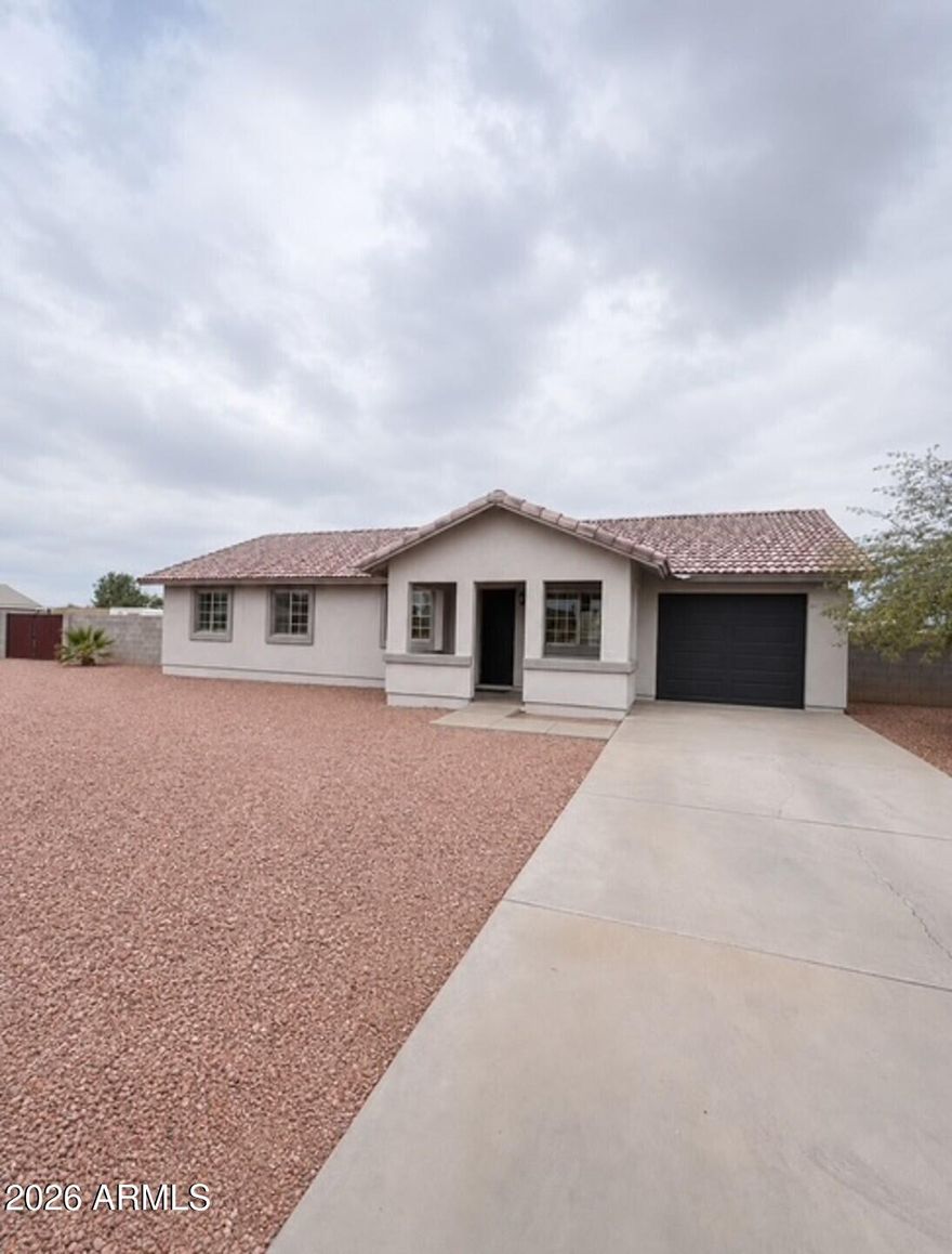 Discover an incredible opportunity with endless flexibility on nearly an acre and no HOA!   Nestled in the heart of Casa Grande, this freshly updated 4-bedroom, 2-bath home with a 1-car garage offers space, convenience, and room to make it your own.  Recently painted inside and out, the home features vaulted ceilings, durable tile flooring throughout, and a gas stove in the kitchen. The expansive lot is fully enclosed with a 6-foot block wall and includes an RV gate, providing plenty of room for toys, trailers, work vehicles, or future possibilities.
Large lots like this are hard to find, especially with easy access to the I-10 freeway just minutes away. Whether you're looking for extra space, privacy, or flexibility, this property delivers exceptional value and potential!