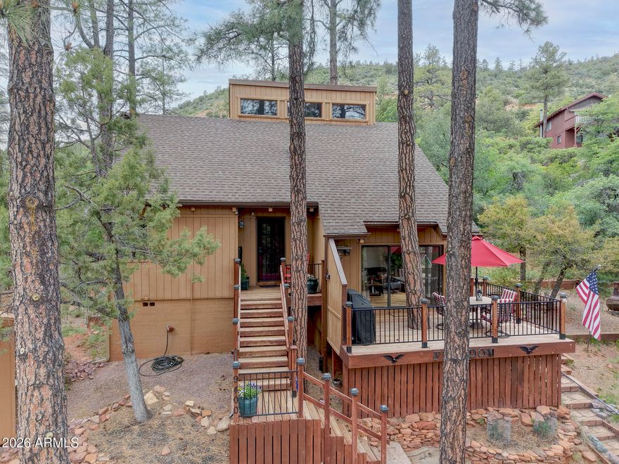 Contemporary mountain retreat on a half-acre in the heart of Strawberry with sweeping forest views. Nestled among towering ponderosa pines, this inviting 2-bedroom, 1-bath turnkey cabin was previously a successful short-term rental and is perfectly suited as a private escape or income-producing property. In addition, there is city water and room to park an RV.
Inside, enjoy warm natural wood finishes throughout and vaulted high-volume ceilings. Large windows and multiple sliding glass doors fill the home with abundant natural light. The updated kitchen features stainless steel appliances and flows seamlessly into the open dining area, with direct access to expansive decks--perfect for morning coffee or evenings under the stars. The cozy living room is anchored by a wood-burning stove, creating an inviting atmosphere for crisp mountain nights. Outdoors, multiple decks offer ample space for relaxing & entertaining. A storage shed provides added convenience, while the generous lot delivers privacy, shade, and room to roam, plus room to park an RV (electric hook-up). Furniture to be included with strong offer (with a few items excluded).
Located along the scenic Mogollon Rim, the property has easy access to services in Payson, miles of hiking trails from Pine Trailhead, ATV routes, nearby Fossil Creek's crystal-clear waters, Tonto Natural Bridge State Park's breathtaking rock formations, Water Wheel Falls, and the expansive Coconino National Forest just moments away. Many nearby local dining destinations include That Brewery & Pub, Old County Inn, Randall House, & The Strawberry Inn Restaurant. The area also offers a rich sense of history and community with attractions like the Strawberry Schoolhouse, the Pine-Strawberry Museum, and outdoor recreation at Green Valley Park.