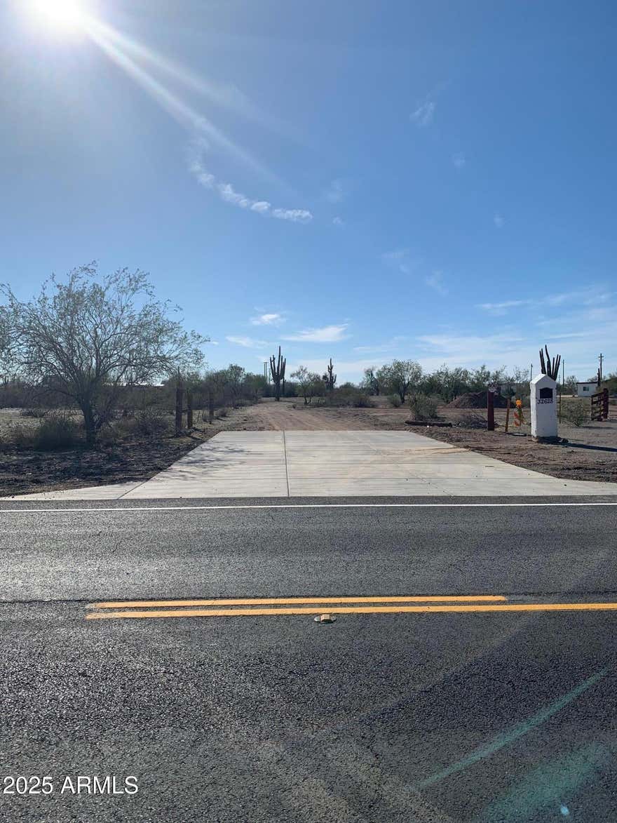 Calling all Investors and people looking to build their custom dream home.  1.1 acres of unobstructed mountain views across from state land.  Water and Electric is on site.   Lot is clear of any washes.  Tucked away for privacy and just off 163rd Ave in Dove Valley.  DOT approved driveway/entrance already installed.  No HOA!