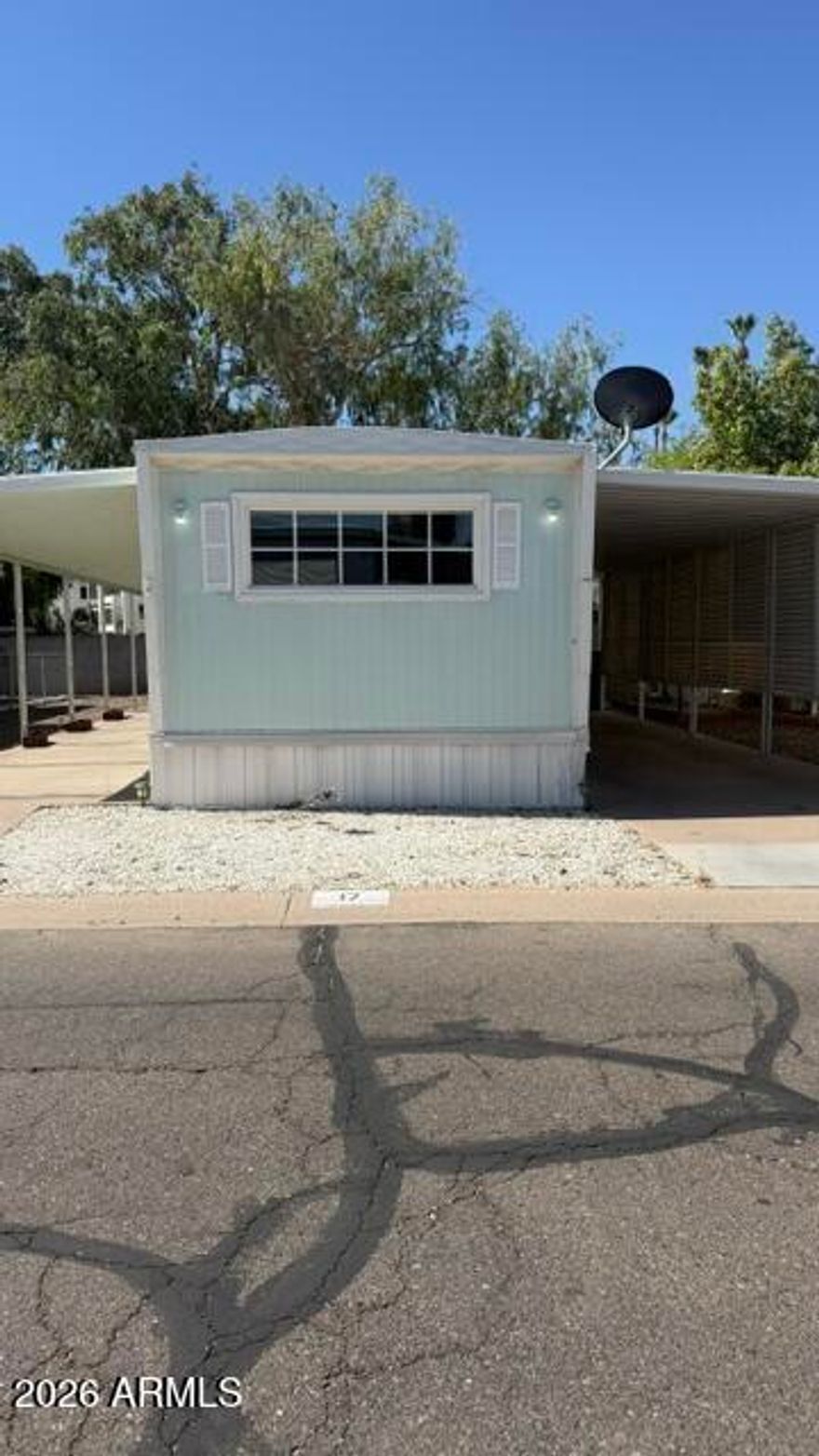 Beautifully updated in 2023, this move-in ready 2-bedroom, 1-bath home is located in one of Mesa's best-kept secret age-qualified communities! Thoughtfully remodeled with modern finishes and accessibility features throughout, this home offers comfort, convenience, and exceptional value.
Recent upgrades include drywall throughout, laminate flooring, dual pane windows, canned lighting, updated outlets/receptacles, ceiling fans, and a fully remodeled kitchen featuring granite countertops, stainless steel appliances, updated hardware/fixtures, and a tankless hot water heater. Bathroom updates include a walk-in shower with grab bars for added accessibility. Additional highlights include a Semper Fi A/C system and included washer & dryer. Conveniently located near the Light Rail with direct Conveniently located near the Light Rail with direct access to Downtown Mesa, Tempe, and Phoenix. Only a short distance from Mesa Riverview, Tempe Marketplace, Cubs Spring Training, Phoenix Rising Stadium, ASU sporting events, Salt River Fields, Scottsdale Fashion Square, and Phoenix Sky Harbor Airport.

Community lot rent is $800/month.

An excellent opportunity for affordable living in a prime location with extensive upgrades already completed!