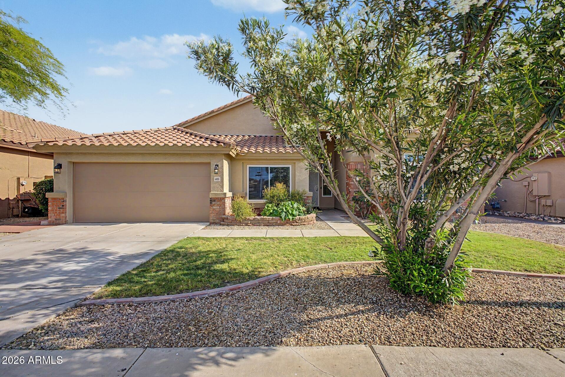 6883 W LAREDO Street