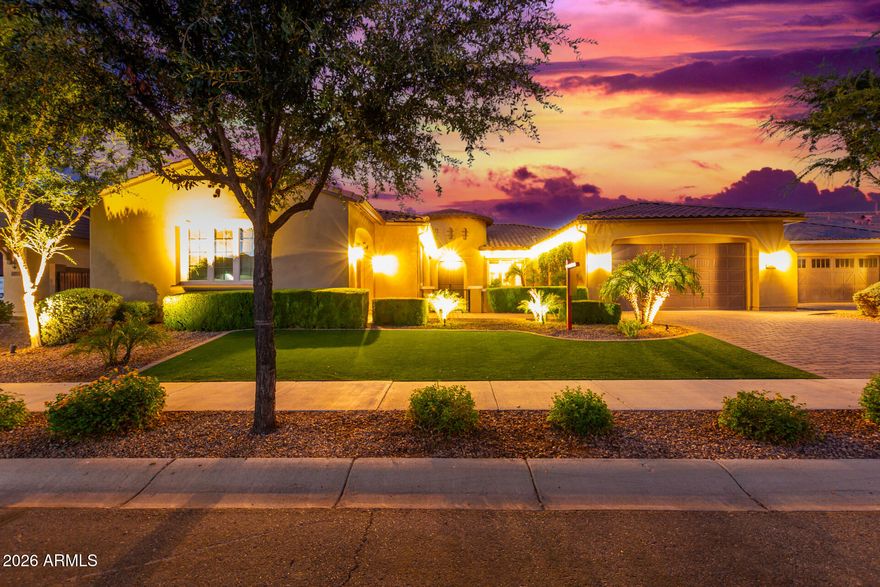 Discover a home that truly sets the standard for luxury living, tucked inside an exclusive gated enclave of just 47 residences. The chef's kitchen is a showstopper, featuring an oversized island, double Wi-Fi-enabled ovens, gas cooktop, built-in refrigerator, two spacious pantries, and custom iron wine and liquor storage. The primary suite is a private retreat with stunning inlaid tile, a soaking tub, and an expansive walk-in shower with dual heads. Each secondary bedroom offers its own en-suite bath and walk-in closet, while a dedicated office provides quiet separation. Step outside to a resort-style backyard with an outdoor kitchen, sports bar seating, in-pool TV viewing, and a heated and chilled pool with waterfall--all beneath a solid-roof pergola for year-round enjoyment.