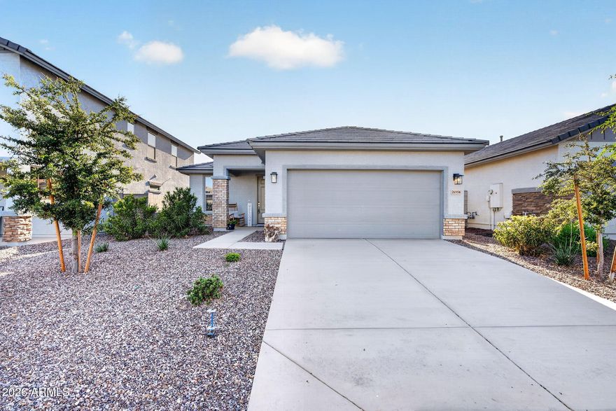 No design center appointments. No waiting 9 months hoping your home gets finished on time. This nearly-new Landsea Madera floor plan in the sought-after Sunrise community is ready right now & the current owner has already done everything you'd wish the builder had included. The open-concept layout immediately makes sense. A dedicated study that works as a home office or flex space & a flow that just feels right from the moment you walk in. But what separates this home from every other new build on the market is the technology baked into every corner. Apple HomeKit smart home integration, whole-house automation, geofencing, & a whole-house air purification system. You're not just buying a home. You're buying a healthier, smarter way to live. This backyard is where this home really wins. The owners envisioned something special and delivered it: a private hot tub for unwinding under the Arizona stars, a cozy fire pit for those perfect desert evenings, pet-friendly synthetic turf that stays lush and green year-round without lifting a finger, and raised garden beds already producing fresh tomatoes and jalapeños. It's like having a salsa maker that conveys with the home! This is the backyard you've been pinning on Pinterest, and it's already built. And the location? Surprise is one of the fastest growing and most desirable cities in the entire Phoenix metro. Close to the Loop 303, White Tank Mountain trails, Lake Pleasant, Surprise Stadium, top-rated schools, and the booming employment hubs of the West Valley. The Sunrise community itself offers parks, walking and biking trails, and a genuine sense of neighborhood. The new construction down the street doesn't have this backyard. It doesn't have these upgrades. And it's not available today. This one is. Don't let someone else get it first.