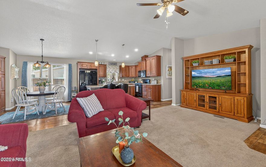 Welcome to this charming home in the desirable Kachina Village neighborhood, surrounded by mature ponderosa pines for a peaceful, private setting. Inside, you'll find an inviting layout filled with natural light, offering comfortable living and entertaining spaces. The well-designed kitchen features ample storage and an eat-in dining area, making it functional for a variety of lifestyles. Step outside to a spacious backyard with a wooden pergola perfect for covered seating, flagstone pathways that add character, and a storage shed for additional space. Enjoy easy access to nearby trails, forest service land, and outdoor recreation A great blend of comfort, charm, and appreciation for the beauty and tranquility of Northern Arizona living just minutes from Flagstaff. No HOA!