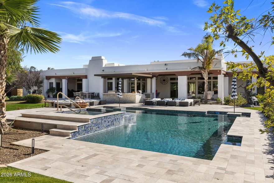 Secluded one-acre estate tucked down a privately owned road just off Scottsdale Rd & Lincoln, where privacy, mountain views, and resort-style living come together in the heart of Paradise Valley.

The property captures mountain views, creating a stunning backdrop for everyday living and unforgettable sunsets. The grounds feel like a private resort with a heated pool and spa, ramada with full outdoor kitchen (grill, smoker, griddle, fridge), fire table, misters, and heaters, plus an incredible estate orchard and raised garden beds for a rare farm-to-table lifestyle.

Recently reimagined through an $800K renovation in 2025, the home now offers bright, contemporary interiors and effortless single-level living with no interior steps. At the center of the home is a chef's kitchen designed for gathering, featuring GE Monogram appliances, a 6-burner gas range, dual dishwashers, cooling drawers, and a fully equipped butler's pantry with wine refrigeration.

The main living space is both elegant and inviting, anchored by a custom saltwater aquarium set into a dramatic stone feature wall, while Sonos whole-home audio and a dedicated media room create the perfect environment for entertaining or relaxing.

A standout feature is the 1,034 sq ft detached casita, offering two bedrooms, its own living space, laundry, sound system, and private security system--ideal for extended family, long-term guests, a caretaker, or a private office/studio retreat.