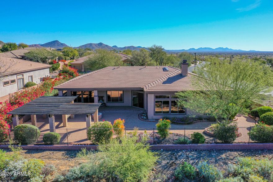 Welcome to a slice of Anthem perfection! This beautifully appointed 4-bedroom, 3.5-bathroom home in Anthem Country Club includes a private guest casita with its own entrance and full bathroom. The serene front courtyard, complete with a soothing fountain, sets the tone for the elegance inside. You'll find neutral tones throughout, accented by 18-inch diagonal tile and textured carpeting.

The kitchen is a chef's dream, featuring a skylight, stainless steel appliances, double ovens, a gas cooktop, granite countertops, raised cabinetry, a breakfast bar, and a spacious walk-in pantry. With a split floor plan offering three additional bedrooms plus a den, you'll have plenty of privacy. MORE Highlights include a Jack and Jill bathroom and built-in garage cabinets. Outside, enjoy stunning views of the desert wash and Daisy Mountain.

As the Tallest REALTOR® in Anthem, I'm here to make sure you find a home that's just right. Feel free to reach out for a personal tour and see why Anthem is truly special.