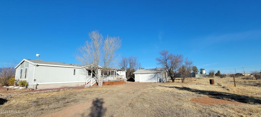 You will not see a better priced home with solar and a 2 car detached garage that has a fenced 4 acre parcel!!! The home has a wonderful floor plan and the covered decks take advantage of the amazing views! There is a huge master suite with a fully handicap accessible bath with a roll in shower, dual sinks plus another sink for hand wash, small pets or ? The secondary bedrooms are on the other end of the home for privacy. There is a lovely formal dining room and a nook off the kitchen. There is a HUGE family room with built ins as well. This home will not last. Seller (Vendee) financing may be available on this property. Please call if you have any questions or for your private showing. This is an AS IS sale.