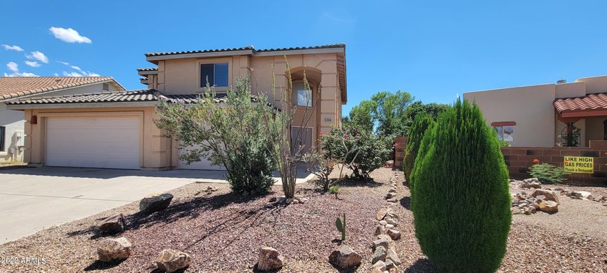 HUGE Price reduction on this large home in Mesa Verde with owned solar and 4 bedrooms with 3 full baths. This lovely home boasts an open formal living/dining room, a large family room with built ins and a wonderful gas fireplace for the chilly nights ahead. The kitchen has beautiful granite counters, stainless appliances, a breakfast bar and beautiful white cabinets for a very clean look. The refrigerator is only a little over a year old.There is a bedroom and a full bath downstairs that is perfect for guests, an office or? Upstairs tha master suite with double doors awaits! The master bedroom is good sized with a large walk in closet, jetted tub with a separate shower, dual vanities and a private commode room. The secondary bedrooms are all good sized with one having a walk in closet. The other upstairs bedroom is huge and has great natural light. There is plenty of room in the 3 car garage with room for a freezer, workbench and the seconary refrigerator also stays with the house. There is ample storage in the cabinetry that is all along one side. The back yard has a covered patio as well as a covered pergola and pet friendly artificial grass. The seller pays the minimum $30.00 monthly fee to SSVEC, the solar does the rest. This terrific home will definitely not last. There is an FHA assumable loan at approximately 304000 at 2.875.