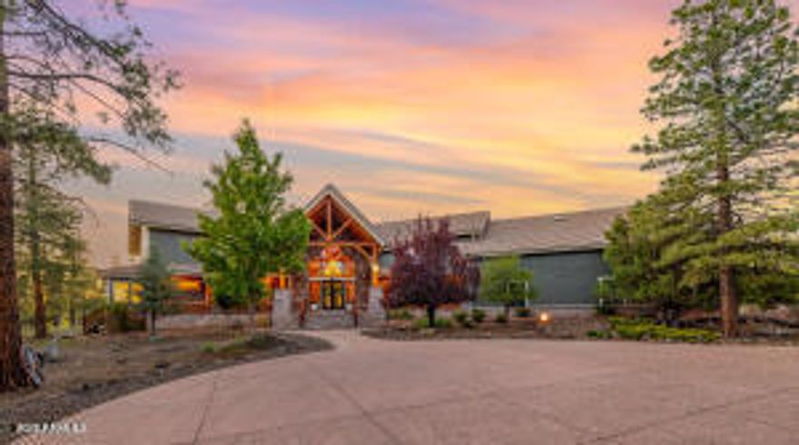 Welcome to 150 Flat Rock Ridge, a stunning custom Timber Frame home on 6 beautiful acres with majestic mountain views. Created by an engineer as a loving gift to his wife and family, this 6,000 sf masterpiece is both home & work of art. The entryway is breathtaking with extraordinary views framed by double curved staircases and beams above. The greatroom is the essence of indoor/outdoor design; a 35-foot vaulted ceiling & picture windows allow you to experience natural beauty - the first greens of spring, the lush vibrance of summer, glorious autumn palettes and white, snow capped mountains from every vantage point in your home.  The spacious kitchen with breakfast area is upgraded with quartz counters & new appliances. It will be your favorite place for friends and family to gather, enjoying both your culinary delights and the exquisite setting.

Relax, stream, play pool or cards, have fun at the bar, and cheer for your teams in your upper-level entertainment area, designed as your private, luxury mountain lodge. Timber Frame construction means you can re-imagine the spaces, add or take out walls and easily curate your personalized, custom retreat.

The outdoor living areas must be experienced in person to be appreciated. Sit quietly or host a party of 50 on your back patio in the presence of fields, birds, ponderosa pines and Mount Humphreys.  Are you an equestrian lover?  With 6 stunning acres you can create the equestrian paradise of your dreams.

More than six types of wood were carefully chosen for each feature. The timber frame itself is old growth Douglas fir; the ceilings are Aspen (a nod to our location); floors and trim are all Jatoba, aka. Brazilian Cherry, one of the hardest choices for wood flooring; interior doors are Alder. The custom cabinets are Cherry and the balusters are Maple.

A shared deep aquifer well, radiant heat, a 4 car tandem garage & additional RV garage with cleanout and hookups, EV charging and large fenced dog run make this home not only beautiful but highly practical. 

Important Note: there is a 1700 sf +/- finished bonus room above the garage that is not included in the square footage of the listing! Use it as a shop, gym, art studio or extra living space. This spectacular home inspires endless possibilities in one of Northern Arizona's most picturesque settings.