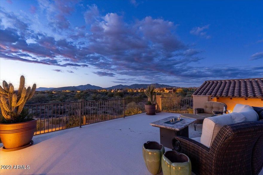 World class opportunity at The Mirabel Club in this private 4BR, 4.5BA + Office + VIEW Deck 4,759sf custom Scottsdale Estate on 0.75 acre of west-facing golf course lot / with ultimate privacy & amazing VIEWS, seen from almost every room! This luxury is never-ending w/ updated kitchen, top appliances, beautifully high ceilings, exquisite wood, stone & metal details, arched entrances, and finest flooring which continues throughout this masterful Estate. Enter through the pavered courtyard, through the grand entrance & into the Living -Game room w/ fireplace - adjacent to stunning dining room w/ new butler's-wine room. The gourmet chef's kitchen is complete w/ luxury appliances, fabulous new counters and back splash, walk-in-pantry, large island w/ sink & kitchen bar seating...(CLICK MORE) Savor Belvedere-style dining area w/ access & views of the foliage and mountains. Open to the spacious living room w/ stunning custom wood sliding doors, cozy fireplace & wet bar. All great for entertaining family & friends. The split floor-plan allows for maximum privacy w/ the Primary & 3 guest rooms on opposite sides of the home. The Primary suite is the perfect getaway with a gorgeous fireplace, sitting area, access to the private patio and yard w/ inspiring views, spacious and private bath w/ stone counters, separate vanities, tub & shower. Creatively magnificent resort landscaping creates a breathtaking backyard, featuring an xl covered patio w/ fans & built-in-BBQ. Revel in the Mountain & scenic views from the rooftop balcony w/ firepit and the dazzling Art Deco-style pool & spa. The backyard also includes waterfall water features & a spacious green area, great for a putting green. Superb location, close world class dining, golf, resorts, spas, hiking, two lakes, the Tonto National Forest, artisan day trips, and so much more! Don't miss out on your dream estate! (See Attached List of Updates @ approximate total of $332,821, everything new, ready and turnkey for the discriminating buyer!) Call for your tour today!