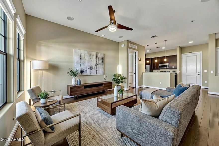 Welcome to your private retreat in the highly sought-after gated community of Artesia, where resort-style living is the standard. Perched on the 4th floor, this 2-bed, 2.5-bath condo offers sweeping golf course and mountain views with 1,330 sq ft of light-filled, open living. Rich wood floors, granite counters, 10-ft ceilings, and a warm gas fireplace create an elevated yet comfortable feel. Wake up to sunrise over the fairway from the primary suite and enjoy sunset skies from your private balcony. Both bedrooms feature en-suite baths for privacy and comfort. Enjoy resort-style amenities, secure gated living, assigned parking, and extra storage. Minutes from Old Town Scottsdale, Kierland, dining, shopping, and entertainment - ideal as a full time residence or lock-and-leave luxury escape.