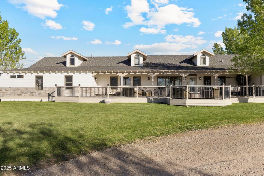 Room to roam, views to love, and space to make your dream lifestyle real. Set in the heart of Prescott, this one-of-a-kind property offers over 35 irrigated acres of flat, usable land—ideal for pasture, riding, and endless Arizona skies.
Known as Happy's Dream Ranch, this estate is more than a place—it's a lifestyle. The equestrian facilities include a 12-stall main barn with generous 12x12 and 12x16 stalls, each with runs, two spacious tack rooms, wash racks, and a convenient fly spray system to keep your horses comfortable. Additionally there is a lower barn that offers 8 additional stalls with the same high-end features—plus a professional Equicisor for conditioning and training. Ride on the 1.25 mile track, in the 120x240 arena or the endless trails in the National Forest. You'll also find a hay barn with a with an attached bunkhouse and a cozy tiny home, perfect for guests or caretakers. The 3-bed, 3-bath residence pairs steel construction and natural stone details with sweeping views in every directionoffering durability, beauty, and tranquility in equal measure. Happy's Dream Ranch is ready to welcome your next chapter.