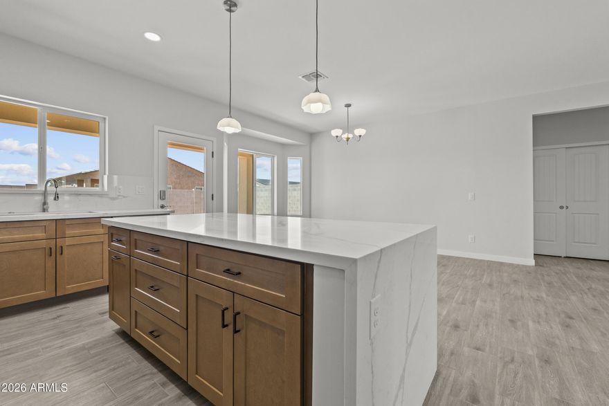 Discover the perfect blend of modern design and Arizona's open-space charm in this beautifully built new construction home in Arizona City. 

Inside, a bright, airy floor plan welcomes you with seamless flow for both everyday living and effortless entertaining. The kitchen impresses with sleek cabinetry, quality appliances, and stylish finishes, opening naturally to the main living space - the true heart of the home. 

Set on a generously sized lot, there's endless potential to create your dream outdoor retreat and unwind beneath breathtaking desert sunsets. 

Enjoy the ease of brand-new, low-maintenance living, ideally positioned between Phoenix and Tucson for quick access to city conveniences while savoring peaceful small-town living.

Seller Financing Option.