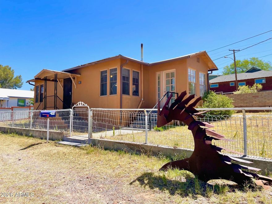 Sitting high up on the hill, you'll love this bright, friendly mid-century vibe desert bungalow with a spacious layout and lots of original features, parking and views! NEW roof April 2026. This solid home is sitting on a large corner lot and will charm you with its beautiful oak floors, hints of mid-century architectural details, and classic built-ins. Do not forget to check out the large kitchen and sunny Arizona room. This property would make a great starter home, retirement home, or turn-key long-term rental. Buyer to verify all facts/figures.