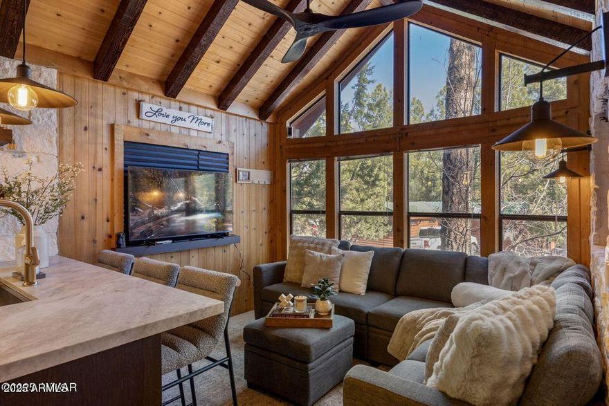 Fully Reimagined Mountain Retreat! ✨ This isn't just a remodel... it's a complete transformation. Every inch of this stunning cabin has been thoughtfully redesigned to create a true move in ready mountain escape with elevated, high end finishes throughout. Step inside to a brand new kitchen featuring custom cabinetry, granite countertops, stainless steel appliances, dishwasher, and sleek modern touches that make cooking (and entertaining) effortless. Heated floors run throughout the home, creating cozy comfort year-round, while all new plumbing, electrical, and fixtures offer peace of mind for years to come. The interior design is next level! • Striking custom stone accent wall • Beautifully stained wood beams in the family room •