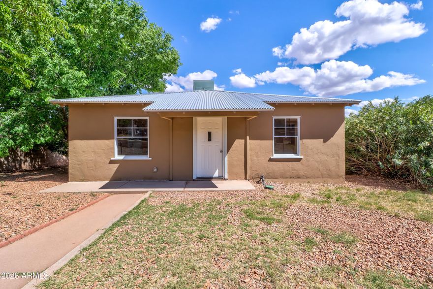 Tastefully remodeled in 2024, carefully maintaining the best of its historic features, this 3 bedroom, 1 bath charming Bungalow shows pride of ownership in every aspect!  Refinished original hardwood floors, new ceramic tile in kitchen & bath, completely remodeled shower, updated electric, ceiling fans, recessed lighting, HVAC, Metal Roof, fresh paint inside & out, updated kitchen with walk-in pantry, stainless steel appliances and new cabinets and counters. French doors invite you outside to the backyard deck to enjoy peaceful mountain views. Includes a 1-car garage with electric. RV gate off the alley w/50-amp RV plug-in.  No detail was overlooked in this move-in ready home.  This is the one you've been looking for. Welcome Home!