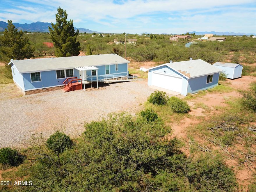 Very well maintained four bedroom two bath handicap accessible home for sell.  Located on 4.305 acres.  Enjoy the beautiful mountain views from the covered patio or while enjoying the hot tub.  Included is 24 x 27 two car garage with electric and a 10 x15 storage shed with shelves. 
Aluminum ramp for wheel chair access, cabinets in kitchen pull out and bars in bathrooms.  New a/c unit and water heater. Available now.