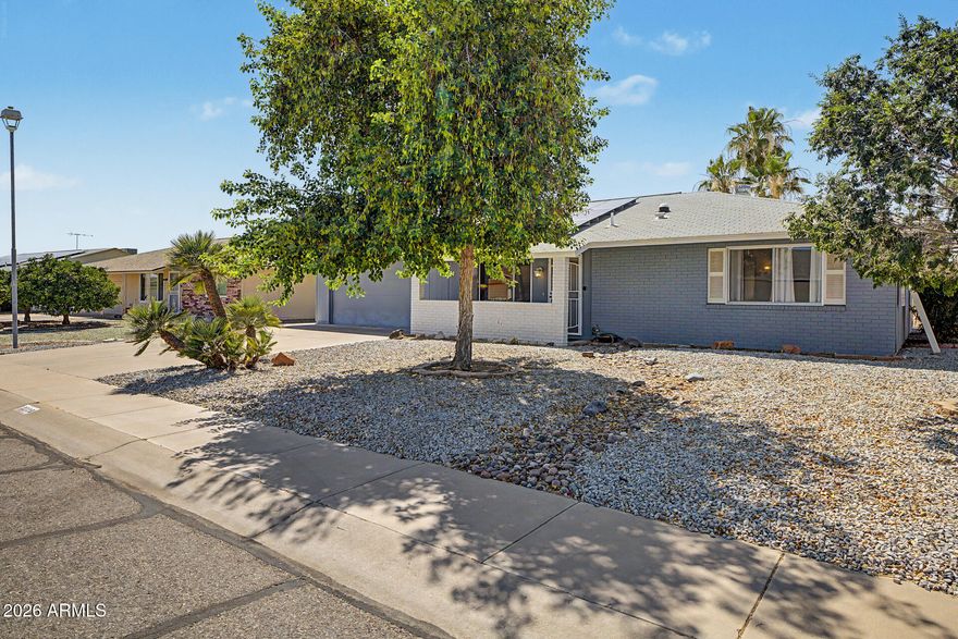 *Selller open to offering CONCESSIONS to PAY OFF SOLAR!* NO HOA!  Huge air-conditioned SHOP area with sink in the extended garage, offering exceptional workspace flexibility and storage. Enclosed ARIZONA ROOM ideal for relaxing, entertaining, or everyday living. Open great room with neutral tile, NEW carpet, FRESH interior paint, SKYLIGHT tubes. Kitchen with STAINLESS appliances and PULL-OUT STORAGE designed for ease and functionality. Primary suite with walk-in closet. Oversized 9,000 sq ft LOT with MAINTENANCE FREE desert landscaping, and mature palms, perfect for enjoying Arizona living! Enjoy all of the amenities and lifestyle the Sun City West community has to offer!