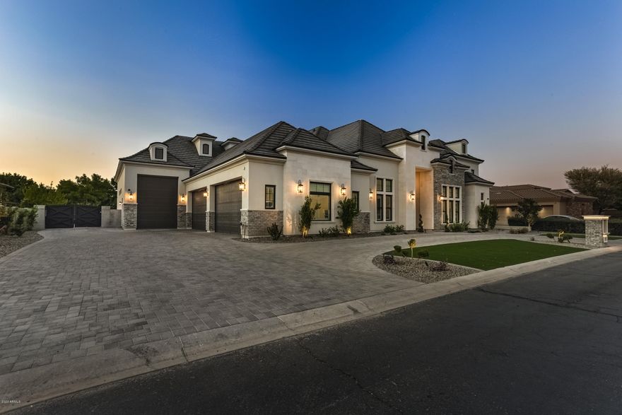 *Full details in docs tab* Stunning energy-efficient basement home in the prestigious gated community of Whitewing at Higley on a premium lot backing to acres of grass & walking paths. Extraordinary French Country Transitional curb appeal with limestone & brick exterior detail.  Interior boasts sophistication & is an entertainer's dream! Featuring 6 bedrooms, den, 7 full bathrooms & 2 half baths (including a pool bath and all en-suites), a TWO-STORY 800sf master closet with laundry, theatre built for stadium seating, vault room, game room, gym/fitness center, Control 4 automation & much more.  The kitchen is a chef's delight with Subzero and Wolf appliances, 4 ovens, Scotsman nugget ice machine & beverage drawers.  An air conditioned 4 car garage & extended 46'x14' RV garage.Schedule today