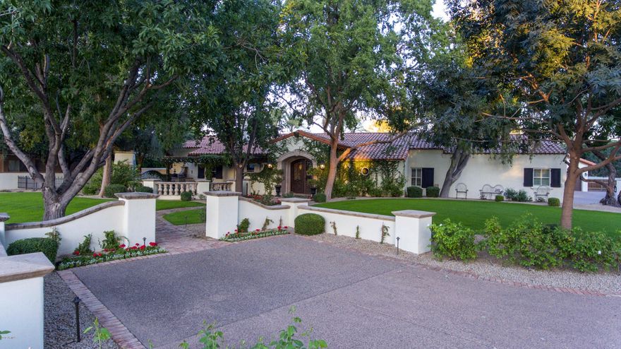 Resort Like Estate on 1.56 acres in the heart of PV Farms. This Mark Candelaria inspired remodel will take your breath away with the stunning millwork, ceiling details, and interior doors. Featuring 5 ensuite bedrooms, 2 powder rooms, game room with brick and wood floors, kids family room, movie theatre, gorgeous paneled library, tons of closet & storage space, a heavenly master bath complete with a steam shower. This home is waiting for the perfect family to discover it! The resort like yard features a huge pool and spa finished with hand inlaid glass tiles, a full sport/pickle ball court, batting cage, pitch and putt golf hole, expansive grassy area, Ramada with 60'' BBQ and gas fireplace. There is a wonderful covered patio that features an additional fireplace, and outdoor living room The front courtyard will charm any buyer with an additional gas BBQ, Canterra Stone fountain and yet another fireplace. The garage can park 3 cars, with an additional space for a tandem sports car and a separate garage for a golf cart. There is also a workshop, and 3 large closets for storage.
Do not miss this home!