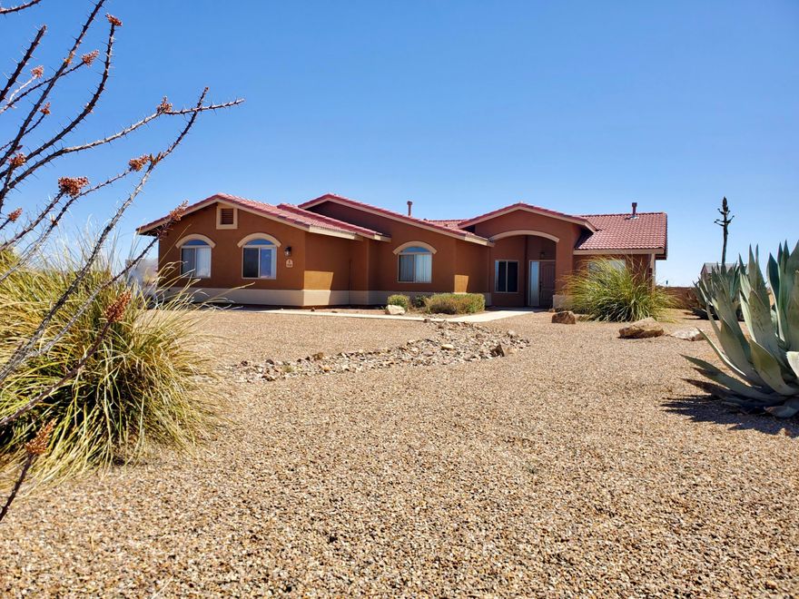 Rare Opportunity Home that has it all!  3 bedrooms with a den that can easily become a 4th bedroom, 2 baths, 3 car garage, mountain views on 4 acres with no HOA, horses allowed. Too much to list but let's try: fresh exterior paint, no carpet, gas fireplace, huge quartz island & countertops, slide outs in cupboards,  & 42'' uppers in kitchen, 2 person spa, washer & dryer convey, separate 50 amp panel in garage (perfect wood shop), 50 gallon propane water heater, views of the Mule, Huachuca and even Dragoon mountains, no neighbors behind you (state land), fully landscaped front yard, clear & level acreage, less than 10 minutes to town.  This one has it all!!