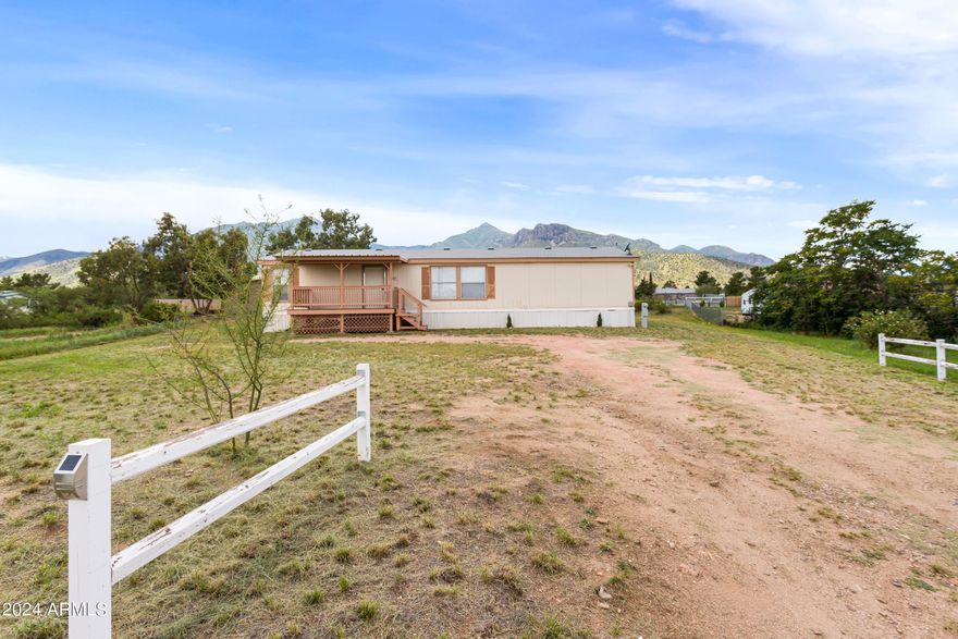 Wake up everyday in your new home that boasts outstanding views of the Huachuca Mountains. Sitting on just about an acre of land, this charming home has 3 bedrooms and 2 bathrooms in a split floorplan layout. A spacious living room leads you into a dining area as well as a kitchen with many cabinets and ample counter top space. In your backyard are two newer sheds that will stay with the property, as well as a platform where the seller loved to enjoy the night skies and awesome views.