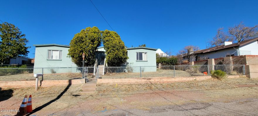 Here is a great opportunity for a big home at a little price.. It could be set up for 2 separate living situations with a shared kitchen and huge family room in the back. Each side has its own entry into a living room space. Each side has 2 bedrooms and a full bath. The kitchen joins the two sides. There are 2 outbuildings for your stuff too. All of this and very close to Vista Park. This is an AS IS sale. The seller will make no further repairs to the property. There is still work being completed and additional photos will be added once everything contracted is done.
