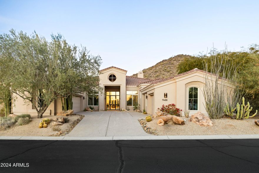 Nestled in the stunning McDowell Mountain Ranch, this contemporary residence combines breathtaking views of city lights and majestic mountains with an interior designed for both luxury and practicality. The split floorplan of the home separates the master suite from the secondary bedrooms, providing privacy and convenience. Adding to its versatility, the property features a casita that can serve as a guest suite, gym, or private retreat, complementing the main house's upscale design. With top-notch Thermador paneled appliances, custom cabinets, and European oak floors, this home encapsulates modern living in the desert, seamlessly blending form and function.