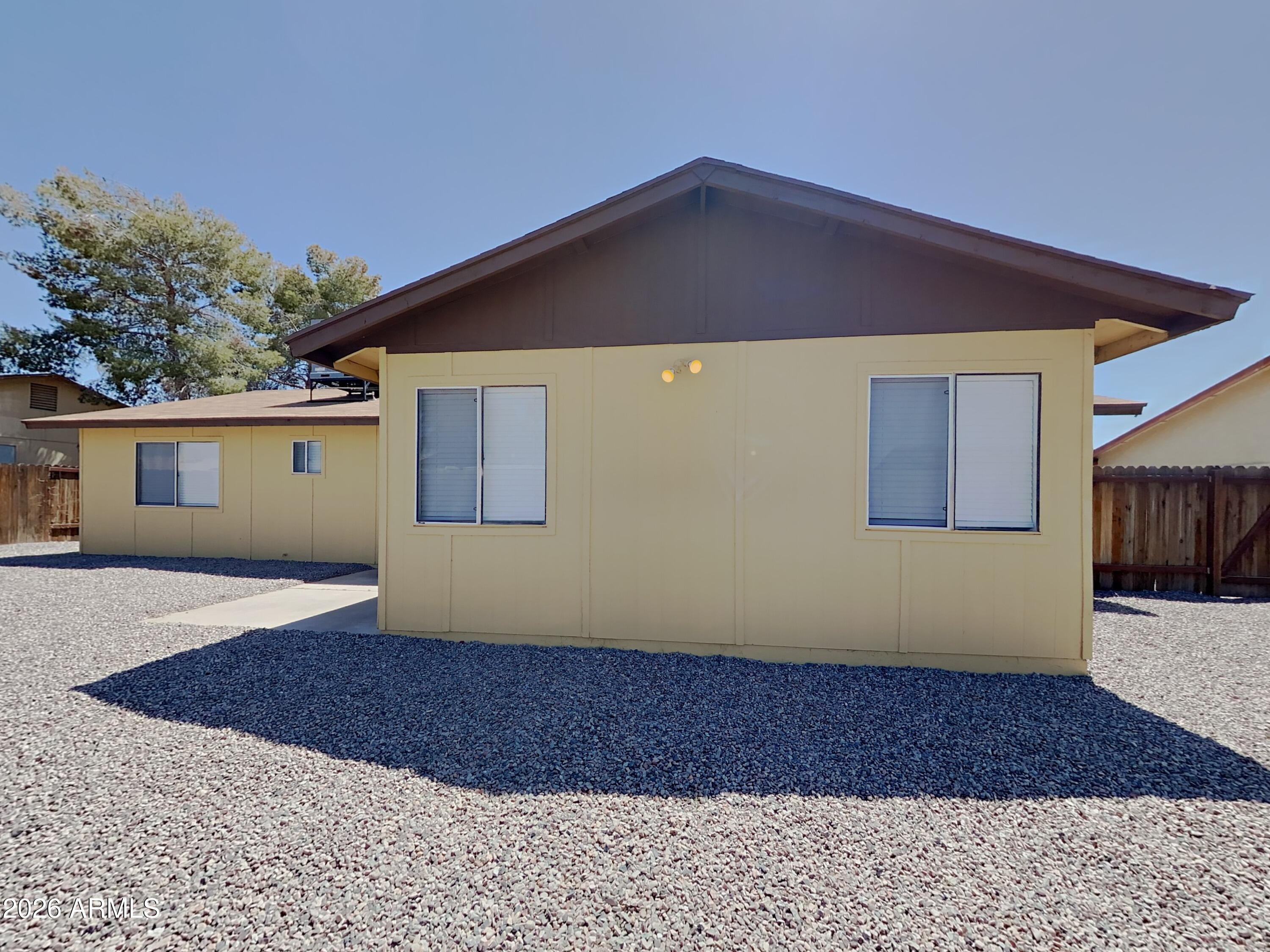 7034 W PURDUE Avenue