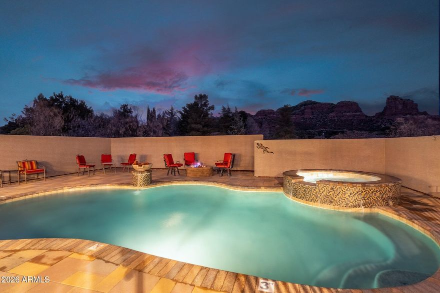 Rare Opportunity: Highly active and consistently booked short-term rental located on a county island in a prime Sedona setting. This single-level residence offers 5 bedrooms and 4 bathrooms, situated on 1.3 private acres with unobstructed, breathtaking Red Rock views. The home is offered turnkey and fully furnished, including all linens, making it ready for immediate ownership and income generation.
The property has been recently updated with new flooring, new appliances, fresh interior paint, and curated Pottery Barn furnishings and décor. A private saltwater pool, an especially rare feature in Sedona that provides year around rentals  Additional highlights include a private guest casita and a spacious open-concept floor plan ideal for bot entertaining and relaxation. Generous on-site parking accommodates multi-generational groups and larger gatherings.
An immediate value-add opportunity is available with a fully permitted, architecturally matching 3-car garage measuring 24' x 38', ready for build-out and offering potential for additional living space, storage, or enhanced rental appeal. No HOA restrictions. The property continues to secure daily bookings and is well-positioned for immediate rental income.
Conveniently located near grocery stores, premier golf courses, dining, and renowned hiking trails.