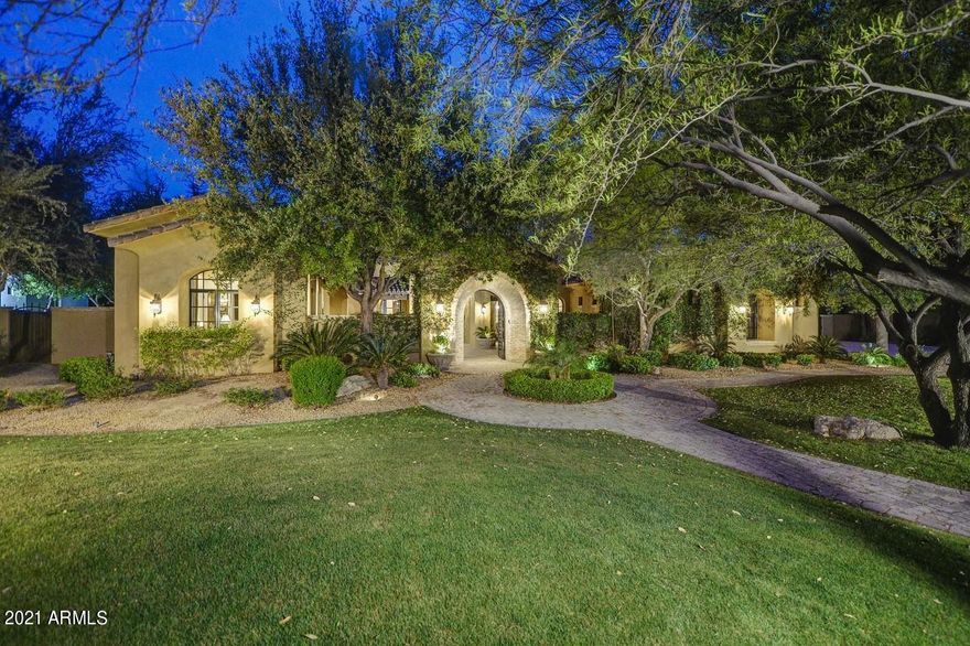 Exquisite custom estate perfectly positioned on a spectacular, premium lot in a beautiful Scottsdale neighborhood. This elegant Tucson style home is an entertainer's dream with a split floor plan, 700 bottle temperature-controlled wine room, butler's pantry & 5 gas log fireplaces with Cantera stone surrounds. The gourmet kitchen features a 60 inch Wolf Range, Subzero refrigerator & 3 dishwashers. There is a full casita, 4 en- suite bedrooms, a bonus room, media room & dedicated office. The spacious master bed/bath suite is the perfect retreat with a walk in closet, claw tub, separate shower and dual vanities. The backyard sanctuary is paradise found with lush green grass & a resort style pool lined with palm trees. There are 5 high efficiency AC's providing 7 climate zones & low E windows. The construction of this home was executed with 8" engineered post tension concrete masonry block on the exterior. This Integra System is filled with polyurethane and then a 2 x 6 interior furring is applied with fiberglass insulation. The doors are made of high quality solid wood knotty alder and there are reclaimed oak floors with the utmost detail. This home was built with the utmost care and attention, providing the highest quality and durability.