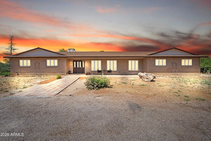 Spacious and beautifully updated 5-bedroom home situated on 4.736 acres in town--offering the perfect blend of comfort, privacy, and convenience. This property features a large screened-in Arizona room, ideal for relaxing or entertaining year-round. The interior boasts recent upgrades including a remodeled kitchen, new paint, and new carpet, creating a clean and modern feel throughout. The well system has also been improved with a new pump and casing for added peace of mind. Property also includes a 14x38 Cavco ADU, sold as-is--perfect for a mother-in-law setup or potential rental income. With ample space for outdoor activities, animals, or future expansion, this rare in-town acreage is a must-see opportunity! Seller is an Owner Agent.