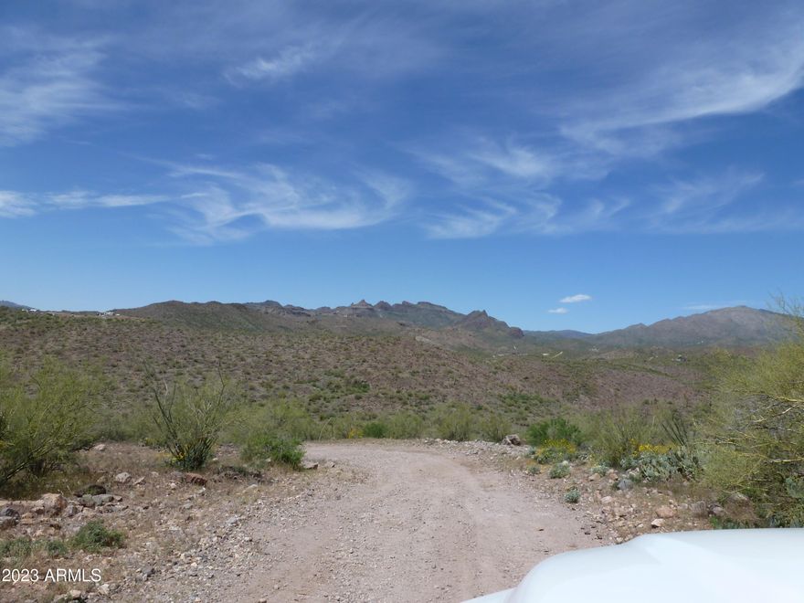 Stunning 8+ Acre parcel with views, backing to BLM land & easy access in Pleasant Country Ranches. Don't miss the opportunity to own in an increasingly popular area nestled in the foothills of the Bradshaw Mountains, close to Lake Pleasant, Dillons By the Bay, the famous Castle Hot Springs Resort and miles of ATV riding right off your property. It's not far to Peoria for all the shopping and services you need. The zoning is one house per 2 acres with guest houses. RV garages are ok. There are 3 other contiguous parcels for sale for a total of 20.19 Acres. Buy all of them so your friends and family can build and enjoy the quiet life. SURVEY IS UNDER THE DOCUMENT TAB. THESE ARE PARCELS A & B on the survey. The wells in the area average from 100 to 400 feet. Mobile homes are not allowed.  Yavapai County offers free building plans to make permitting easier. TAXES ARE ESTIMATED.  
This includes Yavapai County Parcel numbers 204-02-098C & 198D. So, you are getting 2 for the price of one!!