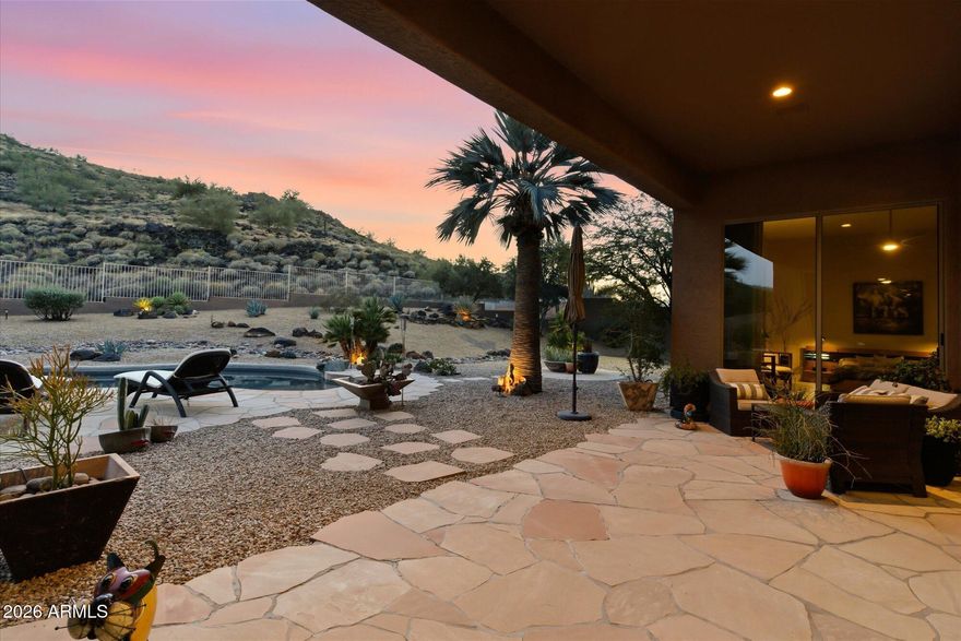 THIS IS A MUST SEE!! Welcome to Pinnacle Hill, a peaceful neighborhood nestled at the north side of Thunderbird Conservation Park in North Phoenix. This almost half- acre property is located in a prime location that backs Thunderbird Mountain with priceless mountain views. The four-bedroom single story home is a showpiece with stunning resort style features. Throughout this well-maintained updated home you'll find gorgeous  tiles and expansive picture windows. Light and bright rooms, updated flooring, large family room with fireplace, formal living room that works great as a game room. Large kitchen with island, granite, stainless steel appliances including walk-in pantry. Primary bedroom opens into the backyard and has large remodeled bathroom and large shower. With three car garage, and a pool this home checks all the boxes!