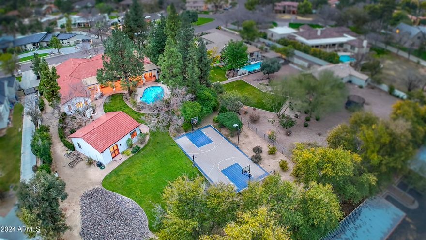 Located in the coveted equestrian community of Circle G Ranches,this absolutely stunning high end 2008 built custom home boasts a walk out basement & beautiful guest casita all situated on a generous .9 acre resort sized lot.Gracious living welcomes you as you enter & are greeted by a retractable wall of glass revealing the lush oasis estate.Modern open kitchen features designer white cabinetry,6 burner gas Thermador range,2 Bosch dishwashers,Sub Zero refrig,ice maker,beverage refrig,walk in pantry,granite & extensive herringbone white tile with grand windows overlooking the park like retreat.Home is light,bright with 10 foot ceilings & open floorplan.Ample covered pavered patios,huge diving pool,lighted sport court,pool bath,built in BBQ,fire pit, gardens,grassy play areas surround the large guest casita.Casita has separate drive & entrance with kitchen,2 bedrooms & bath.Main house is 6523 sf & guest 998 sf.Oversized 3 car garage with temperature controlled storage.Side gate allows access to guest house,ample parking & storage. 6 acre community private park,children's play area,tennis & pickle ball courts,lighted riding arena,equestrian trails.Beautifully maintained community with mature trees. Close to all that desirable South Tempe has to offer:Tech Corridor,top rated schools,dining,shopping,freeway access,Sky Harbor.
Welcome to Circle G Ranches, truly one of the most premier communities in South Tempe. As you arrive through the tree lined entrance, you will know that you are someplace special. The mature landscaping, huge lots and diverse architectural style of the custom estates welcome you home. This custom development is comprised of 159 unique properties as well as a huge private park, tennis and pickle ball courts, equestrian trails and lighted riding arena.Welcome Home!Please see Doc Tab for additional information