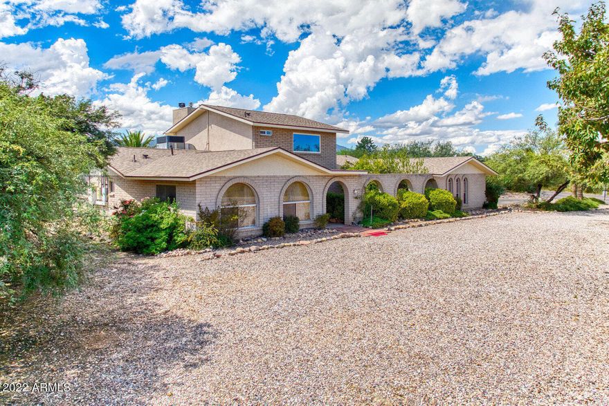 Custom built brick 3200+ sq. ft. home on well manicured landscaped 1+ acre fully fenced  lot with beautiful mountain views.  remolded kitchen w/ Stainless Steel appliances, Adjoining laundry/ storage room .Bonus Arizona room/game room .Study/home office area. Upstairs 4th bedroom/ studio  guest quarters with full bathroom and fireplace,. Primary remolded bathroom with jet tub, double sinks, and new cabinets. Enjoy your inviting Pebble Tech solar heated  swimming pool,4 person spa, Covered gazebo/Ramada  grill, seating area ,Great for  entertaining. Front garden courtyard perfect for quite sitting. Circular driveway. 2 Electric hot water heaters are solar supplemented  water softener.  home warranty in place. septic transferable warranty , new roof 2022 with 10 year transferable  warrant.