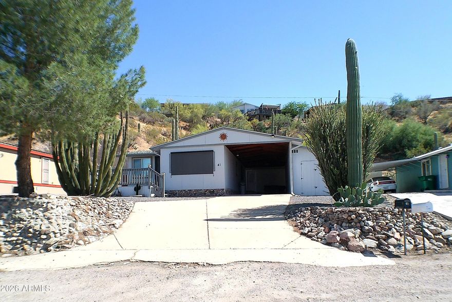 Beautifully Maintained Home with Casita
This charming, well-cared-for home offers a wealth of upgrades and thoughtful touches throughout. Features include a newer roof and newer heat pump for comfort and efficiency, along with updated bathrooms, a remodeled Casita, and a convenient laundry room.

Enjoy the stunning outdoor living space, designed like a private park--perfect for relaxing or entertaining. The property also includes a one-car carport, a large workshop, and a separate golf cart shed for extra storage and convenience.