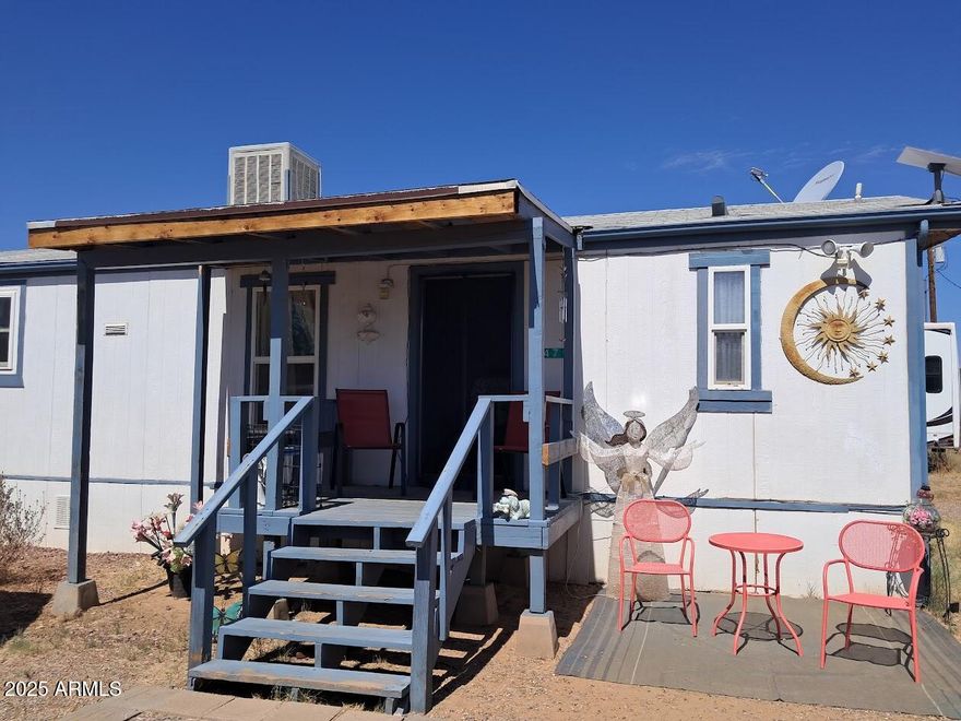 Affordability knocks with this 2 bed 2 bath Manufactured home on an over 12000 sq ft Lot! With electric RV hook ups, Mountain Views an more.