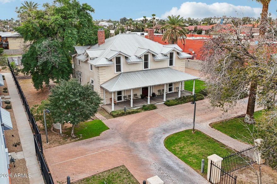 Historic Farmer-Goodwin House is one of Tempe's true architectural treasures. Built in 1883 as ''The grandest house in the Valley'', this rare two-story adobe estate showcases Georgian Revival design, symmetrical floor plan, grand central staircase, lime-plastered walls, and a distinctive hipped roof with ten flush dormers. Live and work in the same home with light commercial zoning. Once home to ASU's first principal, later to prominent rancher James C. Goodwin, this residence is deeply woven into Arizona history. Lovingly restored and thoughtfully revitalized, this property offers a rare opportunity to own a timeless piece of Tempe's heritage. Full of possibilities and flexible spaces, all on a half acre of land with a separate studio. All upstairs bedrooms are plumbed for ensuite baths